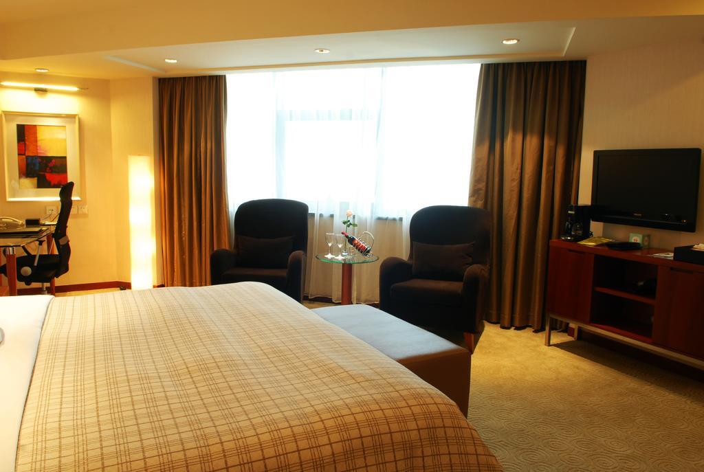 Merryland Traders Hotel Changshu Номер фото